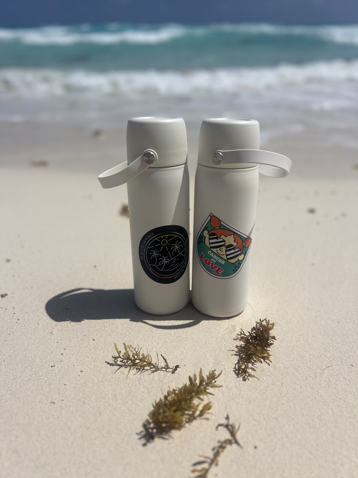 Close-up of two insulated M.O.M. Bag milk cooler containers