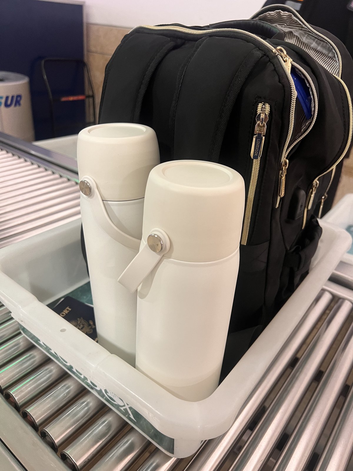 M.O.M. Bag coolers packed in a backpack ready for travel at airport security